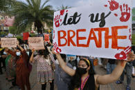 Women's rights activist take part in a demonstration to condemn the violence against women, in Lahore, Pakistan, Saturday, July 24, 2021. The beheading of a young woman in an upscale neighborhood of Pakistan's capital has shone a spotlight on the relentless violence against women in the country. Rights activists say such gender-based assaults are on the rise as Pakistan barrels toward greater religious extremism. (AP Photo/K.M. Chaudhry)