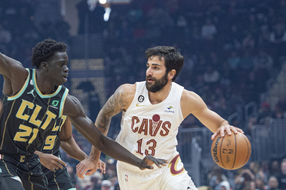 Charlotte Hornets' JT Thor (21) defends against Cleveland Cavaliers' Ricky Rubio (13) during the first first half of an NBA basketball game in Cleveland, Sunday, April 9, 2023. (AP Photo/Phil Long)