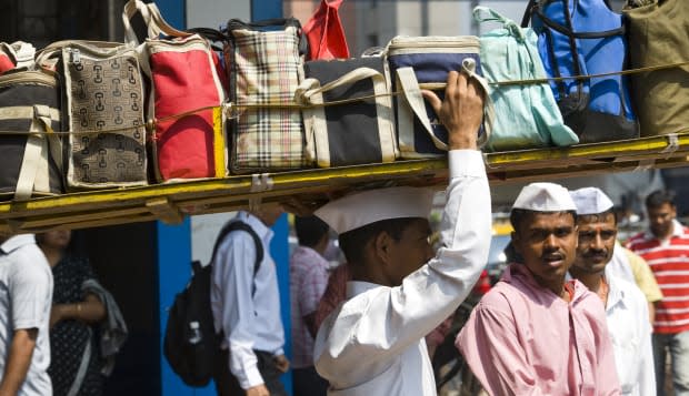 Dabbawala with tiffins at Churchgate railway station.