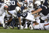 Penn State running back Noah Cain (21) dives for extra yardage near the goal line while being tackled by Auburn defensive tackle Marquis Burks (92) during the first half of an NCAA college football game in State College, Pa., on Saturday, Sept. 18, 2021. (AP Photo/Barry Reeger)