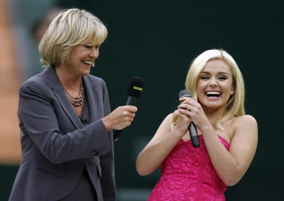 Welsh Opera singer Katherine Jenkins (R) is interview by BBC TV's Sue Barker (L) during the launch of the new retractable roof on centre court at The All England Lawn Tennis Club, England, on May 17, 2009. Andre Aggassi and Steffi Graf against Tim Henman and Kim Clijsters will be playing an exhibition mixed doubles match today on the Centre Court. AFP PHOTO/Glyn Kirk (Photo credit should read GLYN KIRK/AFP via Getty Images)