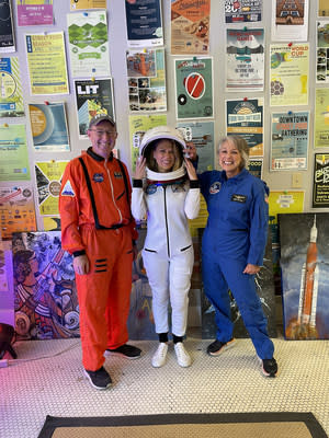 Chad Emerson (left), departing CEO and President of Downtown Huntsville, Inc, promoting Artemis on the Square, a free community event celebrating NASA’s Artemis program in November 2021. Left to Right: Emerson, Jessica Sanders (Director, Marketing, Communication &amp; Strategic Integration at Teledyne Brown), and Marcia Lindstrom (Strategic Communications Team Lead for NASA's Space Launch System, the SLS).