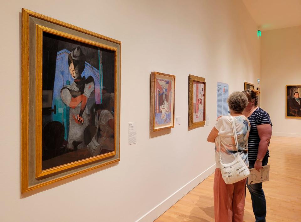 Visitors look at works by Mexican Modernist artists on view at the Philbrook Museum of Art in Tulsa on July 30, 2022. The museum is showing the special exhibit "Frida Kahlo, Diego Rivera, & Mexican Modernism" through Sept. 11.