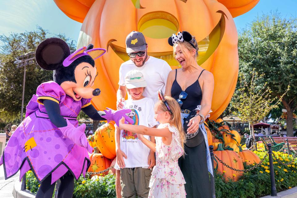 ANAHEIM, CA - SEPTEMBER 26: In this handout image provided by Disneyland Resort, actress Kate Hudson and her family celebrate her daughter Rani Rose's birthday with Minnie Mouse during Halloween Time at Disneyland Park on September 26, 2022 in Anaheim, California. Halloween Time casts a spell throughout Disneyland Resort with family-friendly experiences, including Haunted Mansion Holiday, Mickey Mouse pumpkin photos, favorite Cars Land characters dressed up in festive car-stumes and so much more through Oct. 31. (Photo by Sean Teegarden/Disneyland Resort via Getty Images)