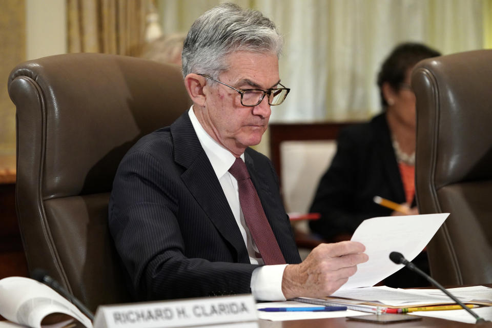 FILE- In this Oct. 31, 2018, file photo Federal Reserve Chair Jerome Powell looks over papers as the Federal Reserve Board holds a meeting in Washington. The Federal Reserve says it will conduct a wide-ranging review next year of the strategies and tools it uses to achieve its congressionally mandated goals of maximum employment and price stability. The Fed says the review will also examine ways the Fed communicates with the public. (AP Photo/Jacquelyn Martin, File)