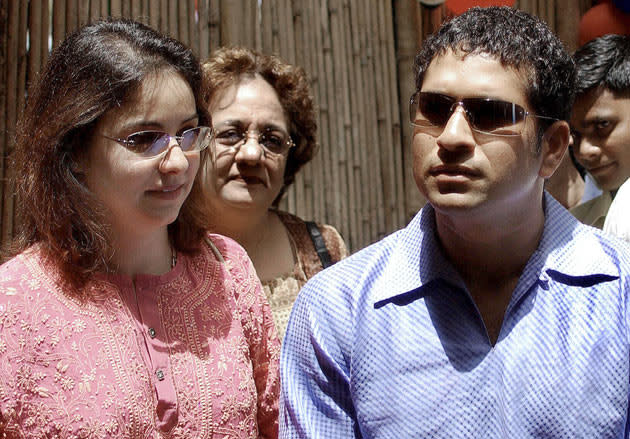 BOMBAY, INDIA: Indian cricketer Sachin Tendulkar (R) along with his wife Anjali (L) looks around the 'The Fun Factory' which he inaugrated in Bombay, 23 April 2004. Tendulkar who celebrates his 31st Birthday 24 April, toured around the fun factory which is an activity and play gym for kids between the age of 2 and 6 years. AFP PHOTO/Sebastian D'SOUZA.