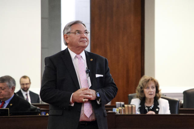 North Carolina state Sen. Jim Burgin, a Harnett County Republican, looks up at the abortion rights activists seated in the Senate gallery before the chamber votes on new abortion restrictions, Thursday, May 4, 2023, in Raleigh, N.C. (AP Photo/Hannah Schoenbaum)
