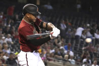 Arizona Diamondbacks' Ketel Marte hits a single against the Los Angeles Angels in the first inning during a baseball game, Sunday, June 13, 2021, in Phoenix. (AP Photo/Rick Scuteri)