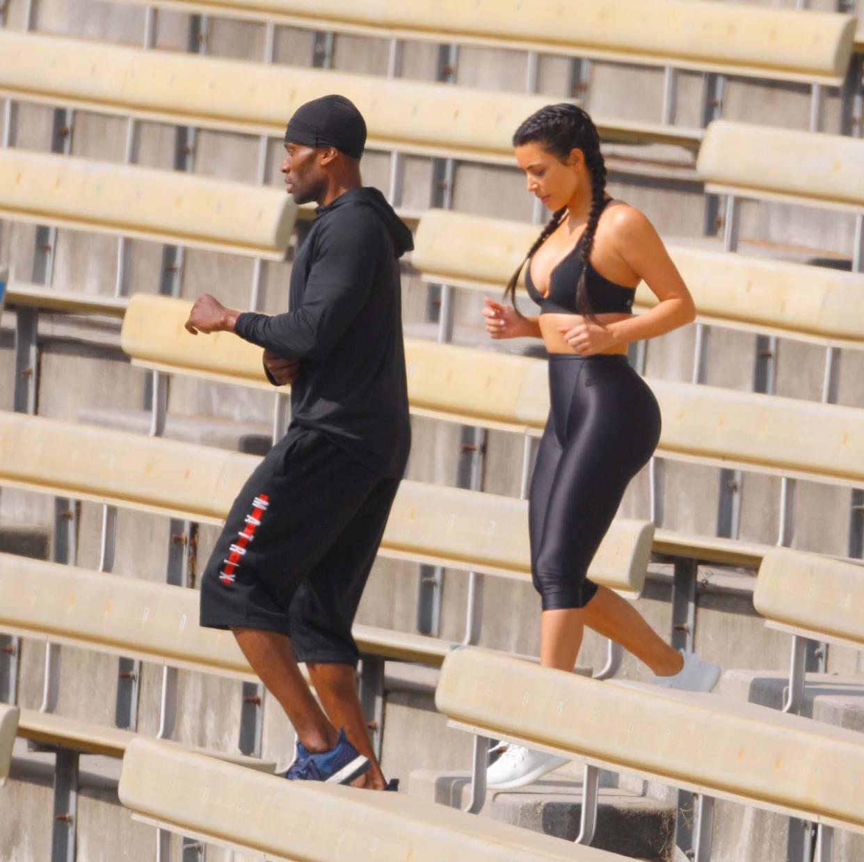 She was seen doing pull-ups and squats as well as running up and down some steps at near-by bleachers. Kim was working out for more than an hour and a half in the Lon Angeles heat before heading back to her car with her bodyguard. PICTURES BY SPLASH NEWS