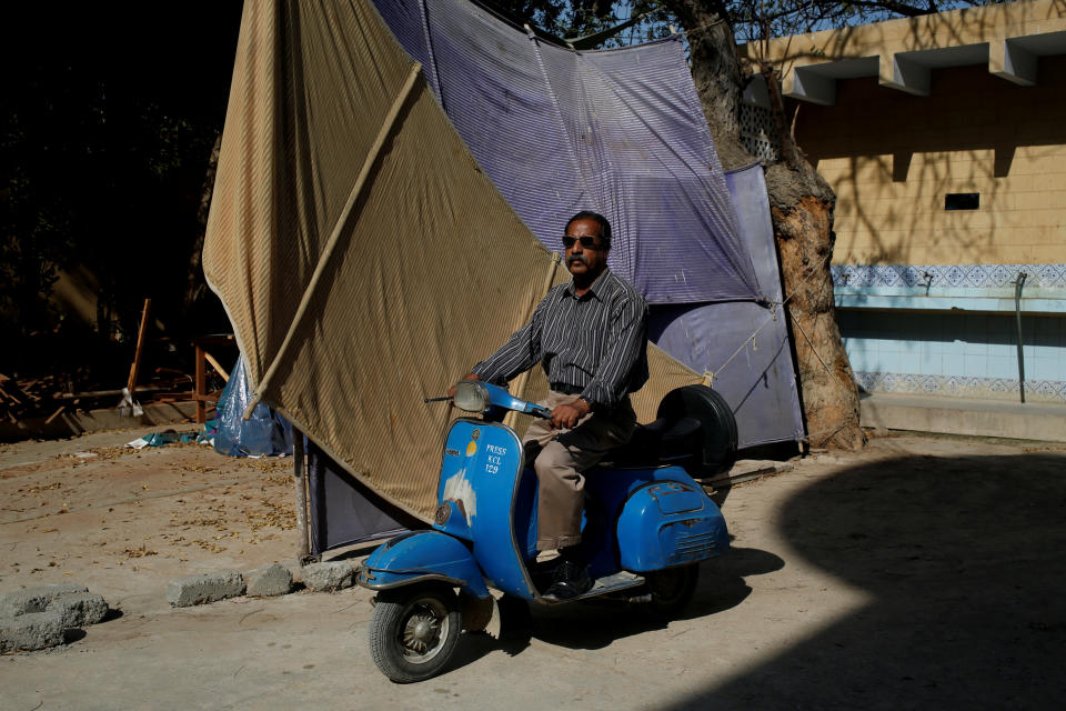 <p>Journalist Nazeer Udding Siddiqui, 58, poses for a photograph with his 1979 model Vespa scooter in Karachi, Pakistan March 6, 2018. “My father used to work for Khwaja Auto as a manager and they were the only distributers of Vespa scooters. For me, people who own Vespas are very honourable people who still keep this tradition alive,” Siddiqui said. (Photo: Akhtar Soomro/Reuters) </p>