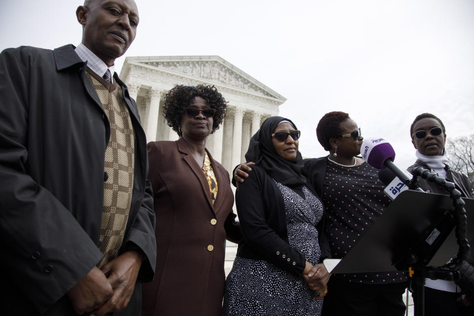 Family and victims of the 1998 U.S. embassy bombings in Tanaznia and Kenya, from left, Tibruss Minja, Doreen Oport, Rukia Ali, Joanne Oport, and Clara Owino, attend a news conference following Supreme Court arguments on punitive damages against Sudan for its role in the attack, Monday, Feb. 24, 2020, outside of the Supreme Court in Washington. (AP Photo/Jacquelyn Martin)