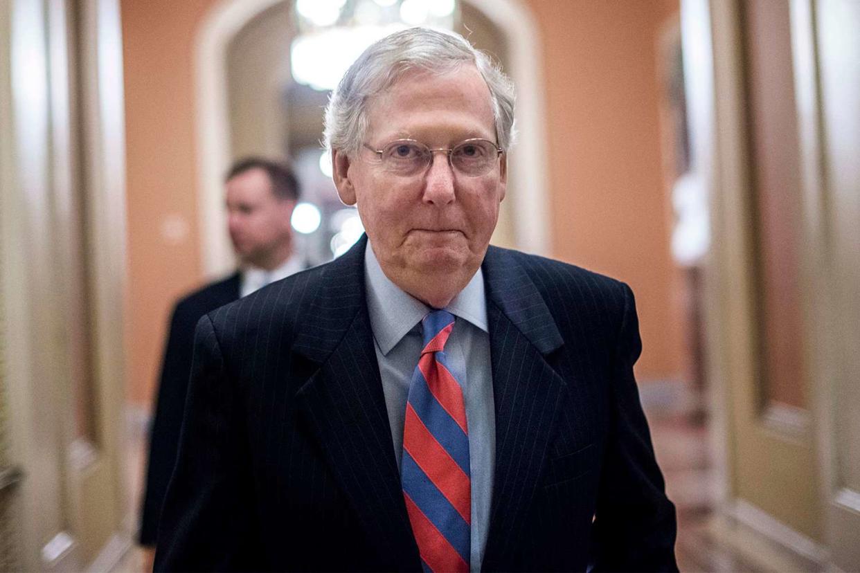 Senate Majority Leader Mitch McConnell goes on and off the floor during an all night session to consider the Republican healthcare bill on Capitol Hill in Washington, DC Thursday July 27, 2017.