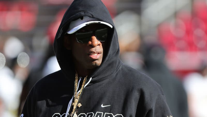 Colorado Buffaloes coach Deion Sanders watches warmups in Salt Lake City on Saturday, Nov. 25, 2023, prior to game against the Utes.