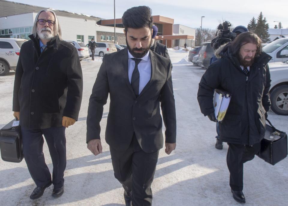 <span class="caption">Sidhu leaves with his lawyers after the third day of sentencing hearings in Melfort, Sask., in January 2019.</span> <span class="attribution"><span class="source">THE CANADIAN PRESS/Ryan Remiorz</span></span>