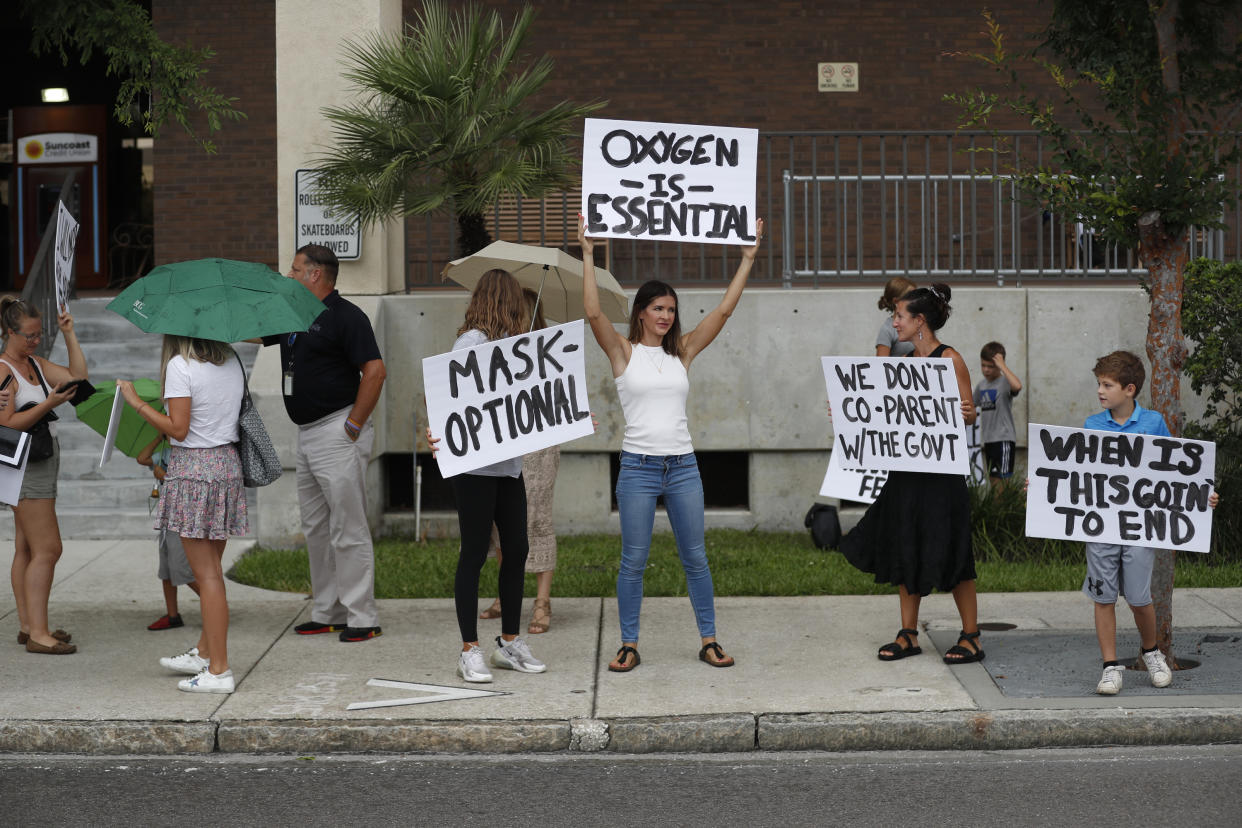 Families protest any potential mask mandates before a Hillsborough County school board meeting in Tampa in the summer of 2021. 
