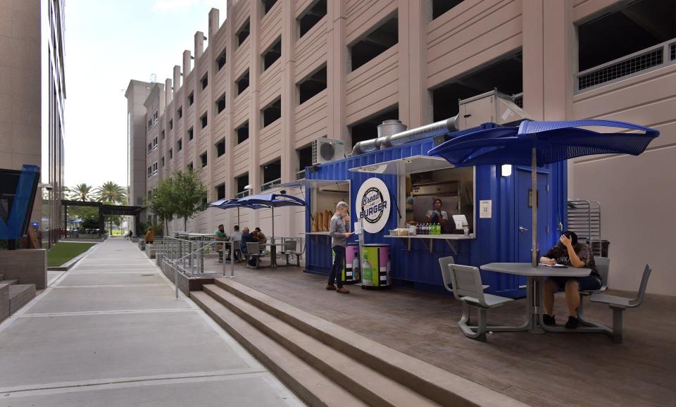 Bread & Burger is in the breezeway between the back of the VyStar buildings and the adjacent parking garage.
