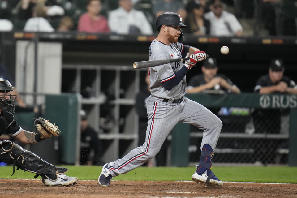 Minnesota Twins' Jordan Luplow, right, grounds out with Chicago White Sox catcher Korey Lee throwing to first baseman Andrew Vaughn for an out during the ninth inning of a baseball game Friday, Sept. 15, 2023, in Chicago. (AP Photo/Erin Hooley)