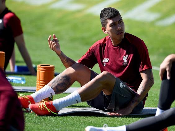 Firmino is back training with Liverpool (Liverpool FC via Getty Images)