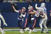 New England Patriots quarterback Bailey Zappe (4) passes in the second half of an NFL football game against the Indianapolis Colts in Frankfurt, Germany Sunday, Nov. 12, 2023. The Colts won 10-6. (AP Photo/Martin Meissner)