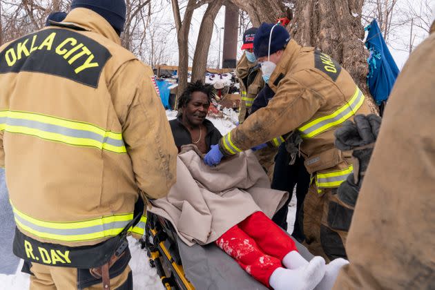 Paramedics in Oklahoma City treat Eugene Rich for frostbite amid record-breaking cold and snow on Feb. 16. (Photo: The Washington Post via Getty Images)