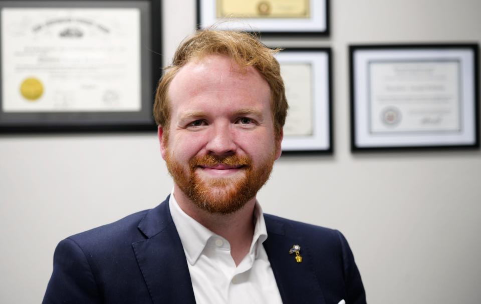 T.J. Roberts, 26, is a Republican candidate for Kentucky House of Representatives District 66. He’s photographed in his office in Covington on April 22, 2024.