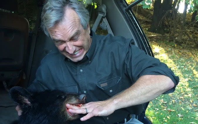 Robert F Kennedy Jr posed with the dead bear cub