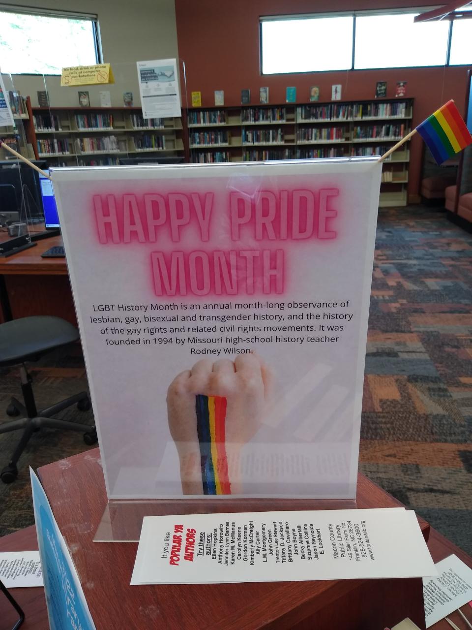 A display for Pride Month featuring LGBTQ books and materials at Macon County Library in June.