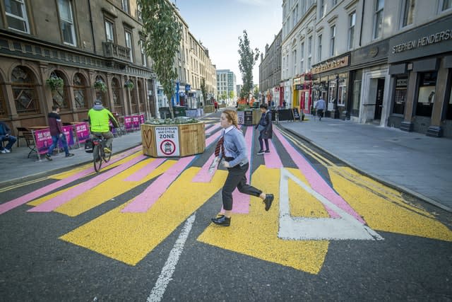 The changing face of the high street. The newly-pedestrianised Union Street in Dundee in Scotland, a previously busy city centre thoroughfare, has been painted with a colourful zebra crossing-style mural to encourage people to explore the street, some six months on from the evening of March 23 when Prime Minister Boris Johnson announced nationwide restrictions 