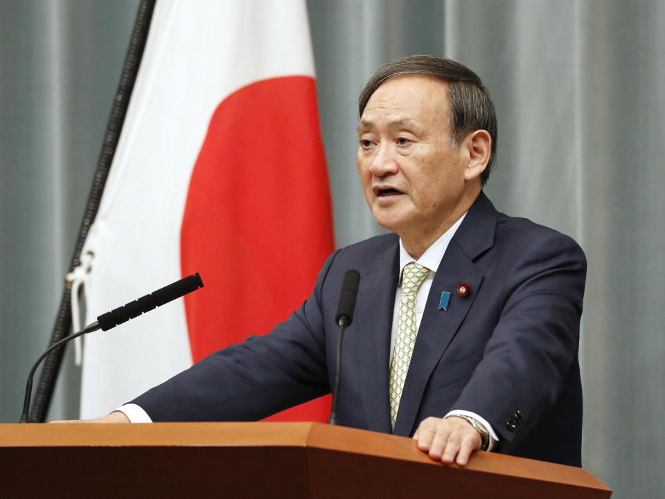 Japan's Chief Cabinet Secretary Yoshihide Suga speaks during a press conference in Tokyo, Tuesday Oct. 23, 2018. Japan's government said Tuesday that a man believed to be a Japanese freelance journalist who went missing three years ago while in Syria has been released and is now in Turkey. Suga told a hastily arranged news conference late Tuesday that Japan was informed by Qatar that the man, believed to be journalist Jumpei Yasuda, has been released. (Kyodo News via AP)