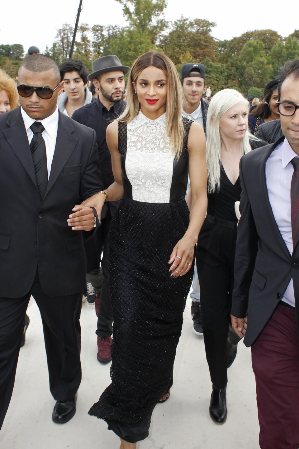 US singer Ciara Princess Harris, also known as Ciara, centre, arrives to attend the presentation of Valentino's ready-to-wear Spring/Summer 2014 fashion collection, Tuesday, Oct. 1, 2013 in Paris. (AP Photo/Thibault Camus)