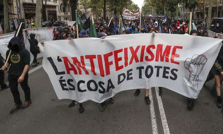 Protestors take part in an anti-fascist demonstration on Spain's National Day in Barcelona, Spain October 12, 2018. REUTERS/Albert Gea