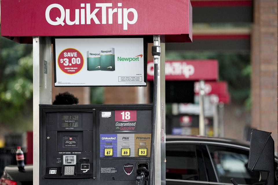 A person pumps gas, Tuesday, Sept. 12, 2023, in Marietta, Ga. Georgia's governor Brian Kemp is suspending state taxes on gasoline and diesel fuel, declaring a legal emergency over higher prices, Tuesday. (AP Photo/Mike Stewart)