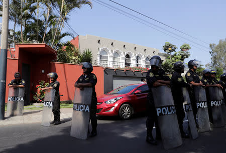 Police officers stand guard outside the house of Peru's former President Pedro Pablo Kuczynski after a judge ordered Kuczynski to ten days in jail in connection with a money-laundering investigation, in Lima, Peru April 10, 2019. REUTERS/Henry Romero