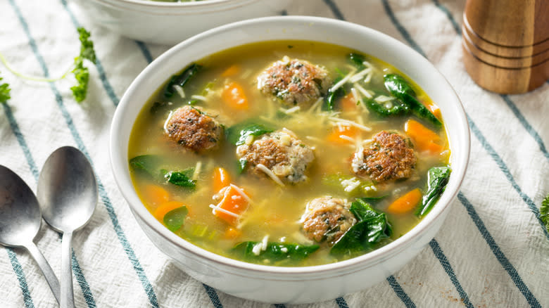 Italian meatball soup in white bowl