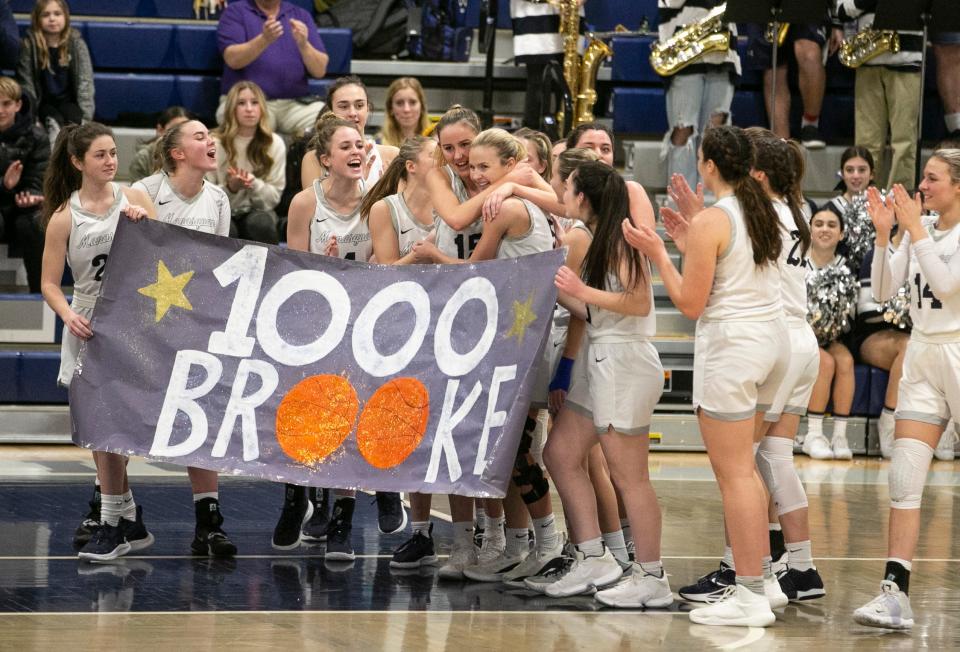 Holmdel at Manasquan basketball. Manasquan's Brooke Hollawell is congratulated after scoring her 1000th point.     
Manasquan, NJ
Friday, March 4, 2022