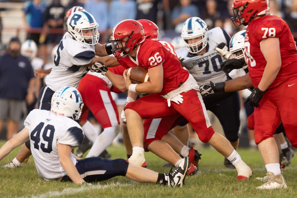Field junior running back Drexal McAmis drives through the line during a Week 3 game against the Rootstown Rovers.