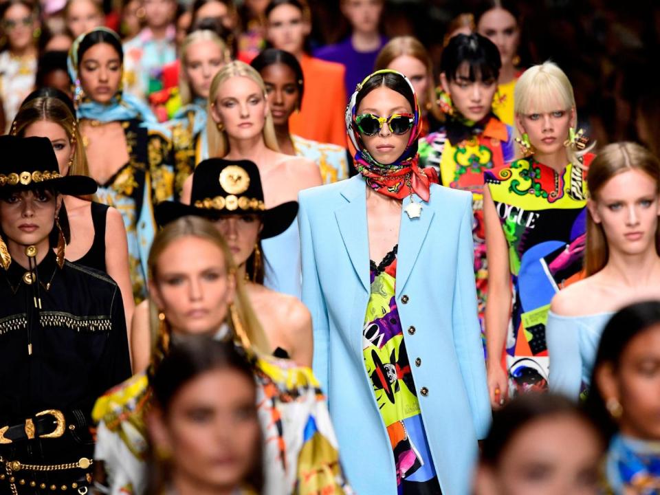 Models present creations for fashion house Versace during the Women's Spring/Summer 2018 fashion shows in Milan, on September 22, 2017 (MIGUEL MEDINA/AFP/Getty Images)