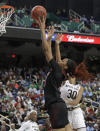 Louisville's Bionca Dunham, left, shoots against Notre Dame's Mikayla Vaughn (30) during the first half of an NCAA college basketball game in the championship of the Atlantic Coast Conference women's tournament in Greensboro, N.C., Sunday, March 10, 2019. (AP Photo/Chuck Burton)