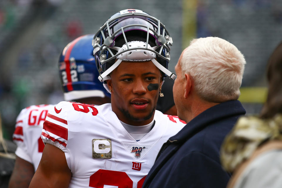 EAST RUTHERFORD, NJ - NOVEMBER 10:  New York Giants running back Saquon Barkley (26) and New York Giants co-owner Steve Tisch prior to the National Football League game between the New York Jets and the New York Giants on November 10, 2019 at MetLife Stadium in East Rutherford, NJ.  (Photo by Rich Graessle/Icon Sportswire via Getty Images)