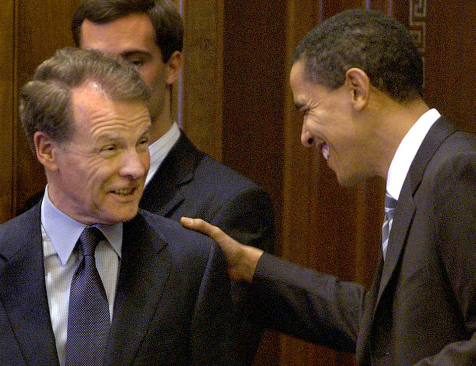 FILE - In this Nov. 8, 2004 file photo, then-U.S. Sen. Barack Obama, D-Ill., right, and then, Illinois Speaker of the House Michael Madigan, D-Chicago, left, appear in the Illinois State Capitol in Springfield, Ill. State Rep. Madigan, a Chicago Democrat who virtually set Illinois' political agenda as House speaker before he was ousted last month, announced Thursday, Feb. 18, 2021 that he is resigning his seat in the Legislature. Madigan once spoke disparagingly of then-U.S. Sen. Barack Obama, then sponsored legislation to erect Obama's presidential library in Chicago. (AP Photo/Seth Perlman File)