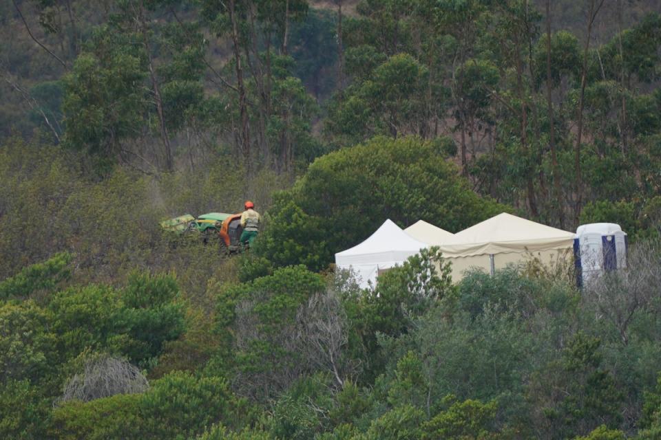 Personnel clear undergrowth with machinery at Barragem do Arade reservoir, in the Algave, as searches continue as part of the investigation into the disappearance of Madeleine McCann (Yui Mok/PA) (PA Wire)