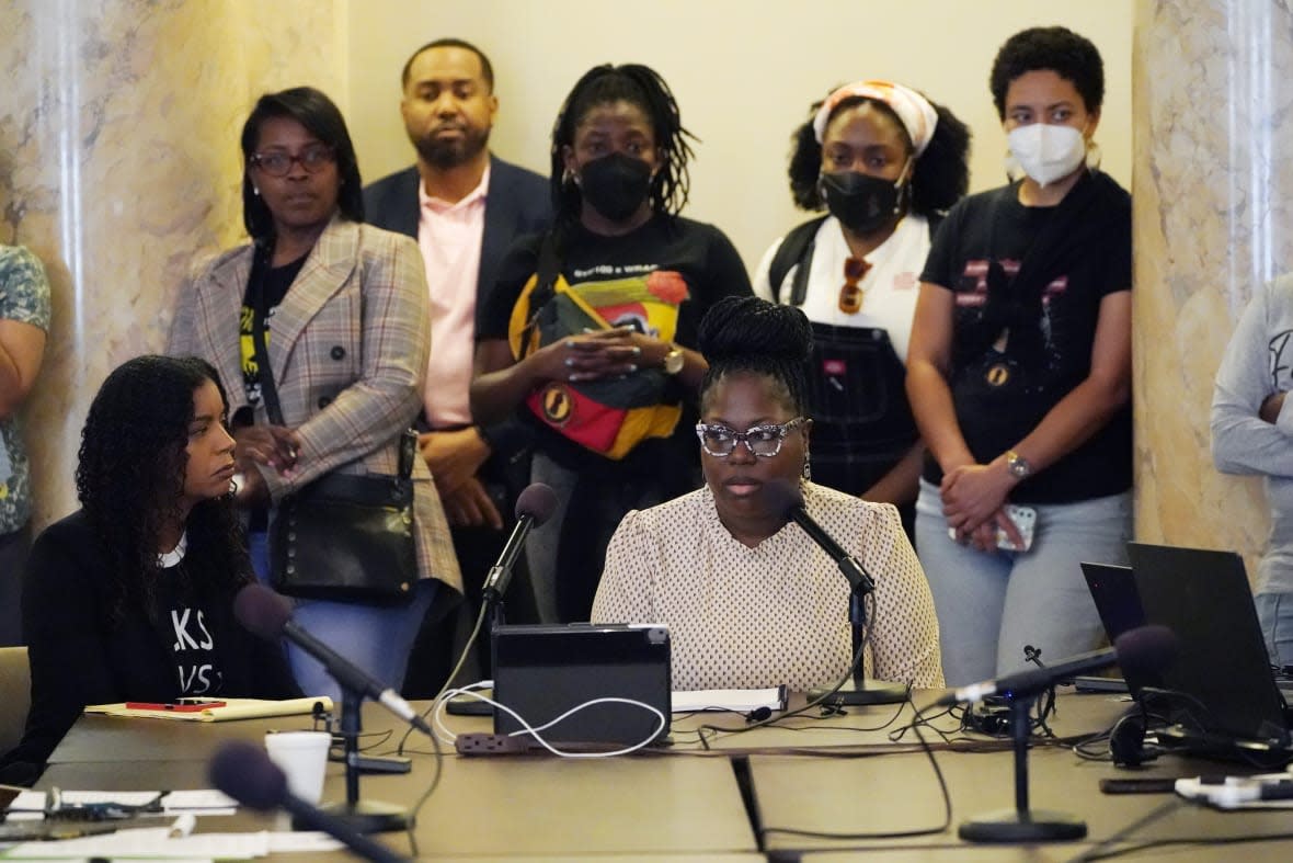 Arkela Lewis, bottom right, mother of Jaylen Lewis, who was shot to death during an encounter with officers of the Mississippi Capitol Police department, testifies before members of the Jackson delegation of the Mississippi Legislature at the Mississippi Capitol in Jackson, Monday, March 6, 2023. (AP Photo/Rogelio V. Solis)