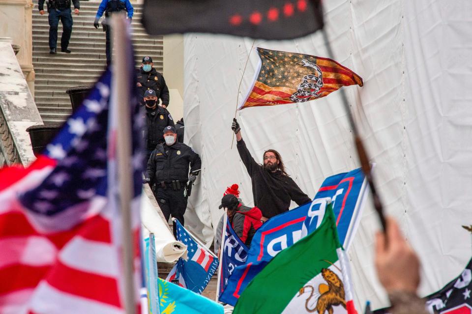 <p>A fight attendants union has called for rioters to be unable to board flights to return home from Washington DC</p> (AFP via Getty Images)