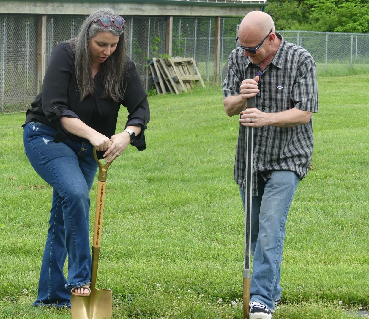 Executive Director Jenn Thomas and Board President Johnnie Johnson break ground on the new Ross County Humane Society dog shelter on May 9, 2024.