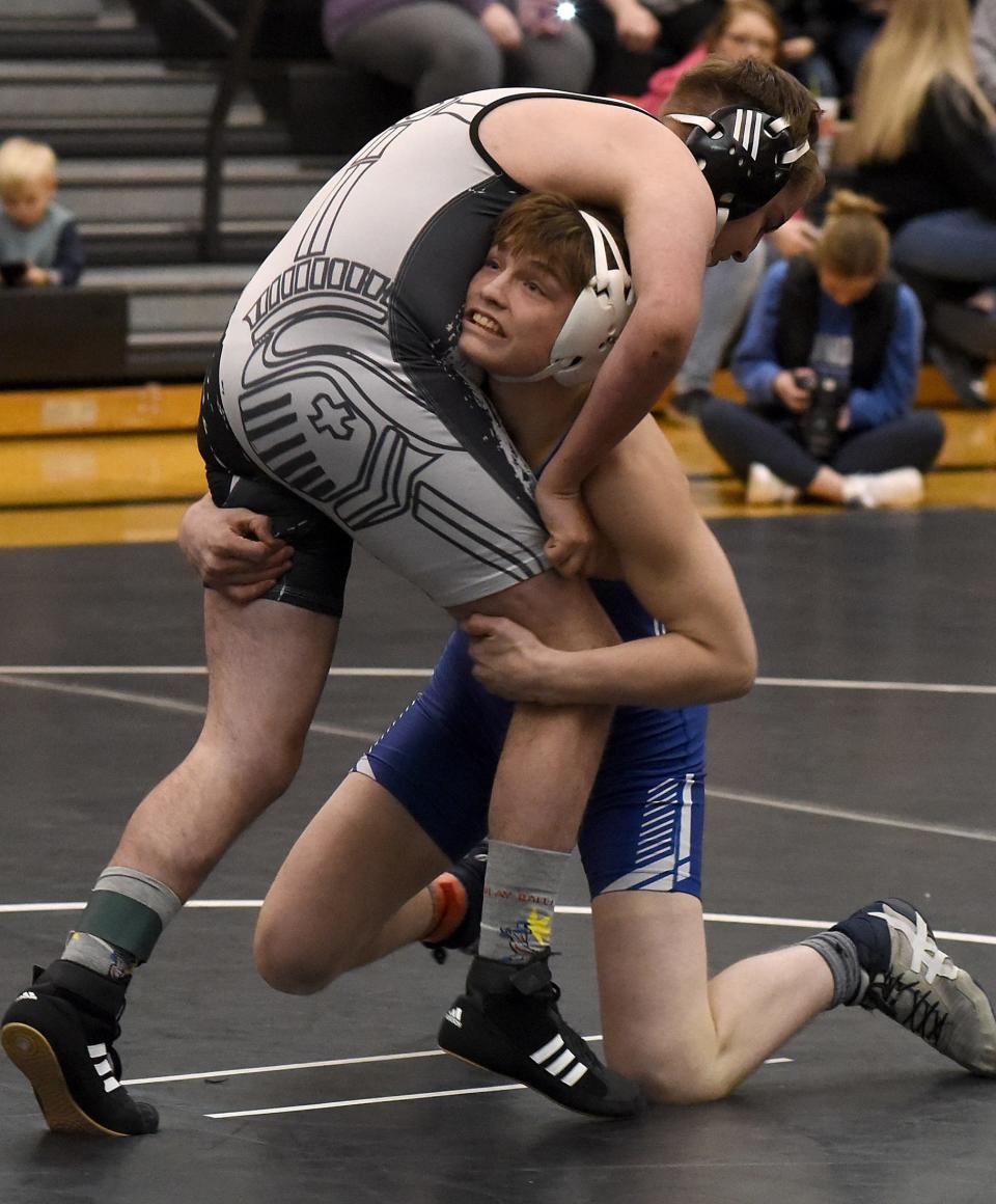 Dundee's Kole Katschor of Dundee lifts Joe Glinn of Lutheran Westland at 165 pounds Wednesday, Katschor had a pin to help the Vikings win 68-9 in the finals of the Division 3 Regional Lutheran Westland hosted.