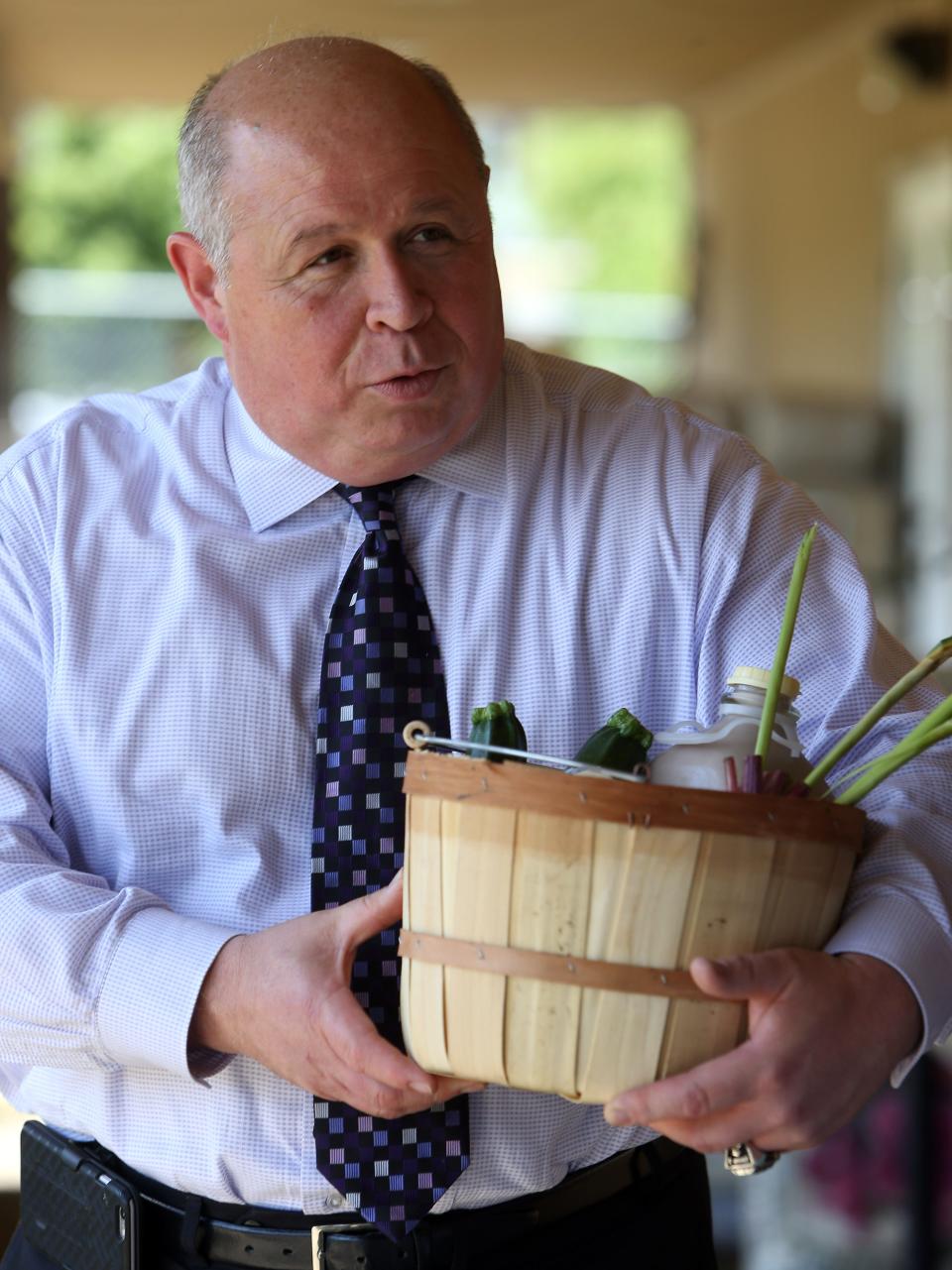 Parsippany Mayor James Barberio buys fresh produce at the Parsippany Farmer's Market in 2017.