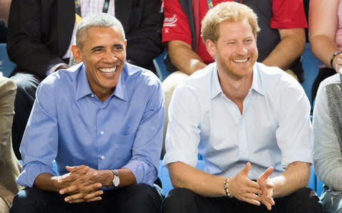 Barack Obama and Prince Harry watch the wheelchair basketball at the Invictus Games - Credit: Samir Hussein