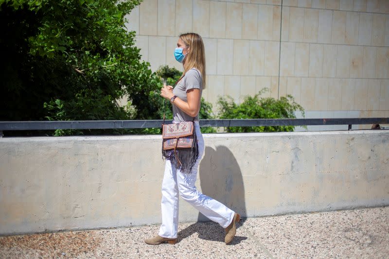 Israeli model Bar Refaeli wears a face mask amid the coronavirus disease (COVID-19) pandemic as she leaves after her court hearing in Tel Aviv