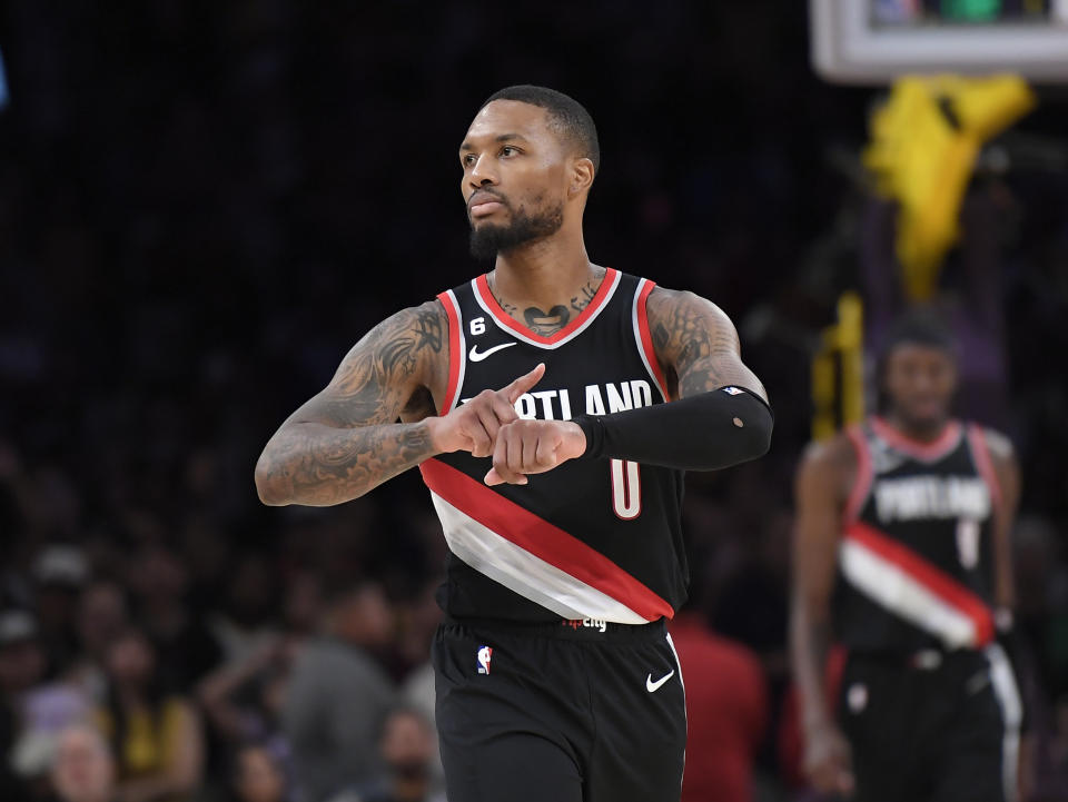 LOS ANGELES, CA - OCTOBER 23: Damian Lillard #0 of the Portland Trail Blazers celebrates as he points to his wrist after scoring a three-pot basket in the closing seconds of the game against Los Angeles Lakers at Crypto.com Arena on October 23, 2022 in Los Angeles, California. NOTE TO USER: User expressly acknowledges and agrees that, by downloading and or using this photograph, User is consenting to the terms and conditions of the Getty Images License Agreement.(Photo by Kevork Djansezian/Getty Images)(Photo by Kevork Djansezian/Getty Images)