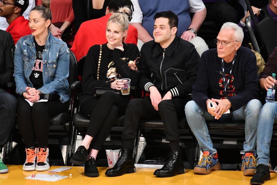 Lucy Boynton and Rami Malek at a Basketball game